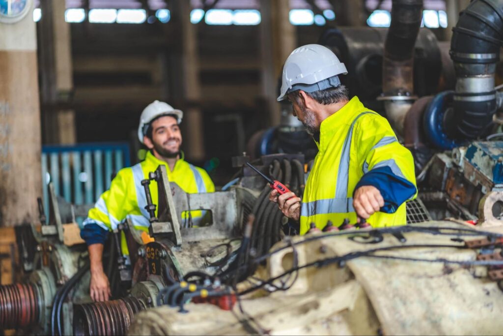 two millwrights workers in an industrial construction plant