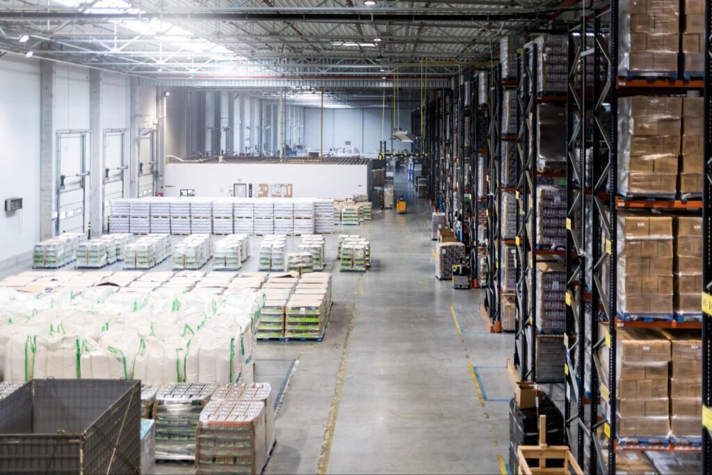 a warehouse service in Boston Massachusetts by Atlantic Millwrights with many boxes and shelves 
