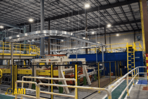 industrial machinery installed inside warehouse facility with safety railings